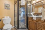 Very bright bathroom with large shower